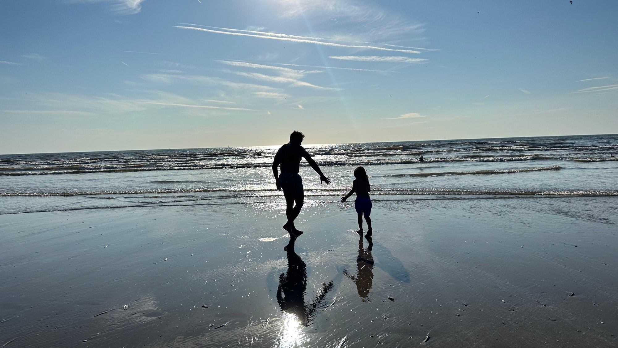Together by the sea in Bali, against the light